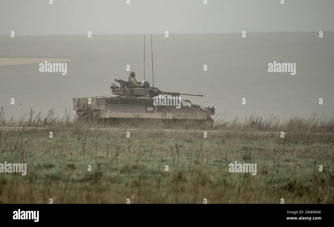 close-up of a British army Warrior FV510 armoured fighting vehicle in action on a military combat exercise,Wiltshire UK Stock Photo