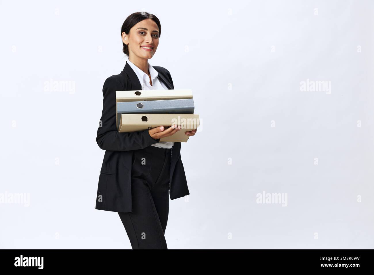 Business woman with a folder of documents in her hands in a black ...