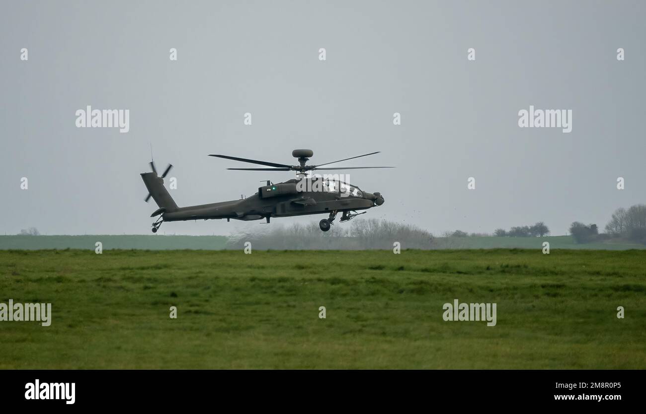 close-up of ZM707 British army Boeing Apache Attack helicopter (AH-64E ArmyAir606) in low level flight, Wiltshire UK Stock Photo