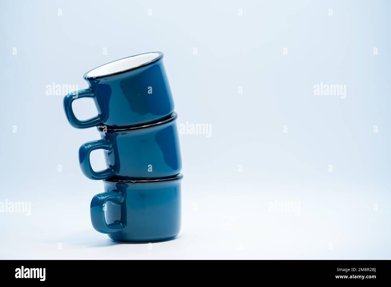close-up of three blue ceramic glazed coffee cups Stock Photo