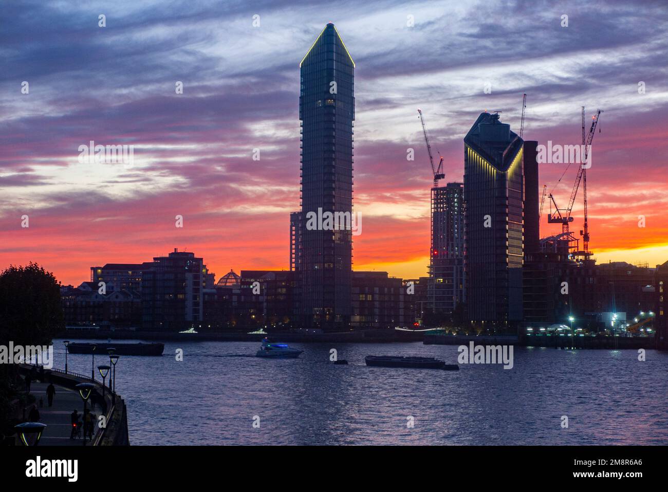The Chelsea Waterfront skyline on the River Thames at sunset with Tower