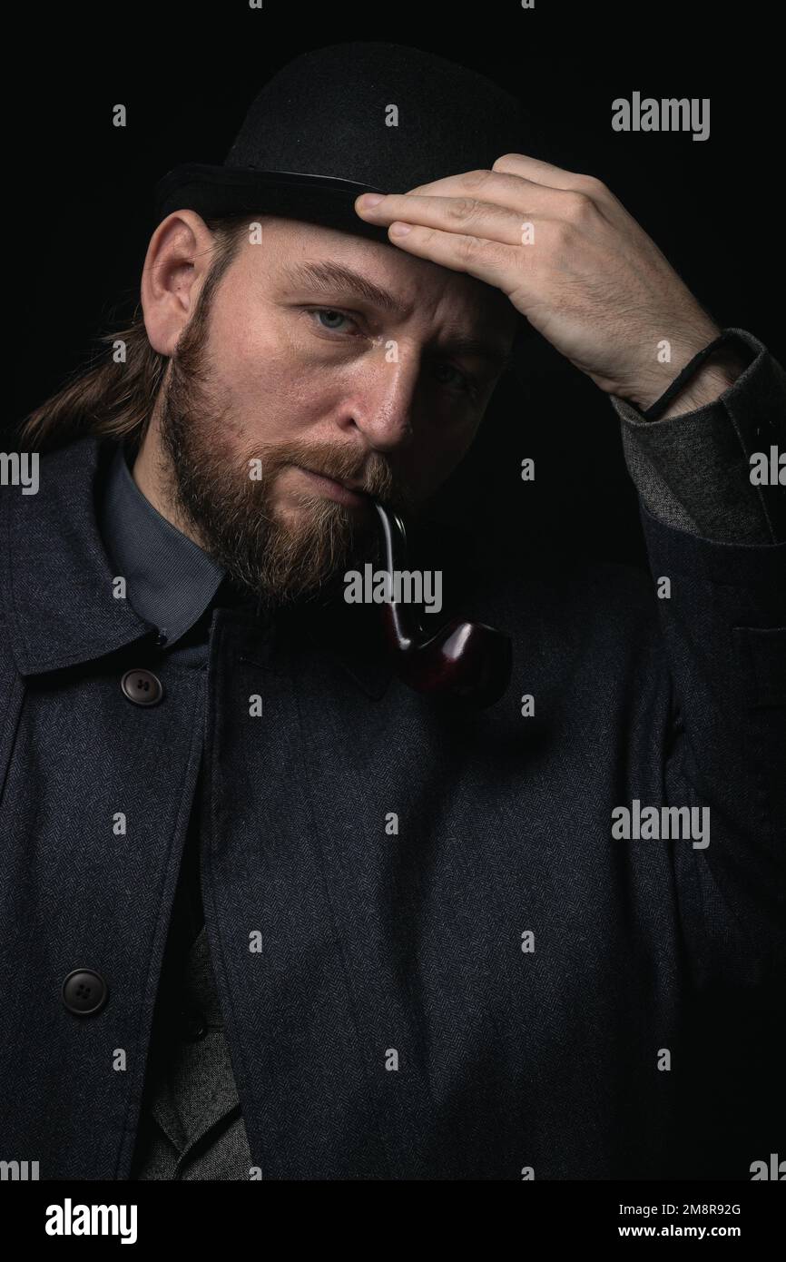 stylish man in retro outfit suit hat smoking wooden pipe sherlock