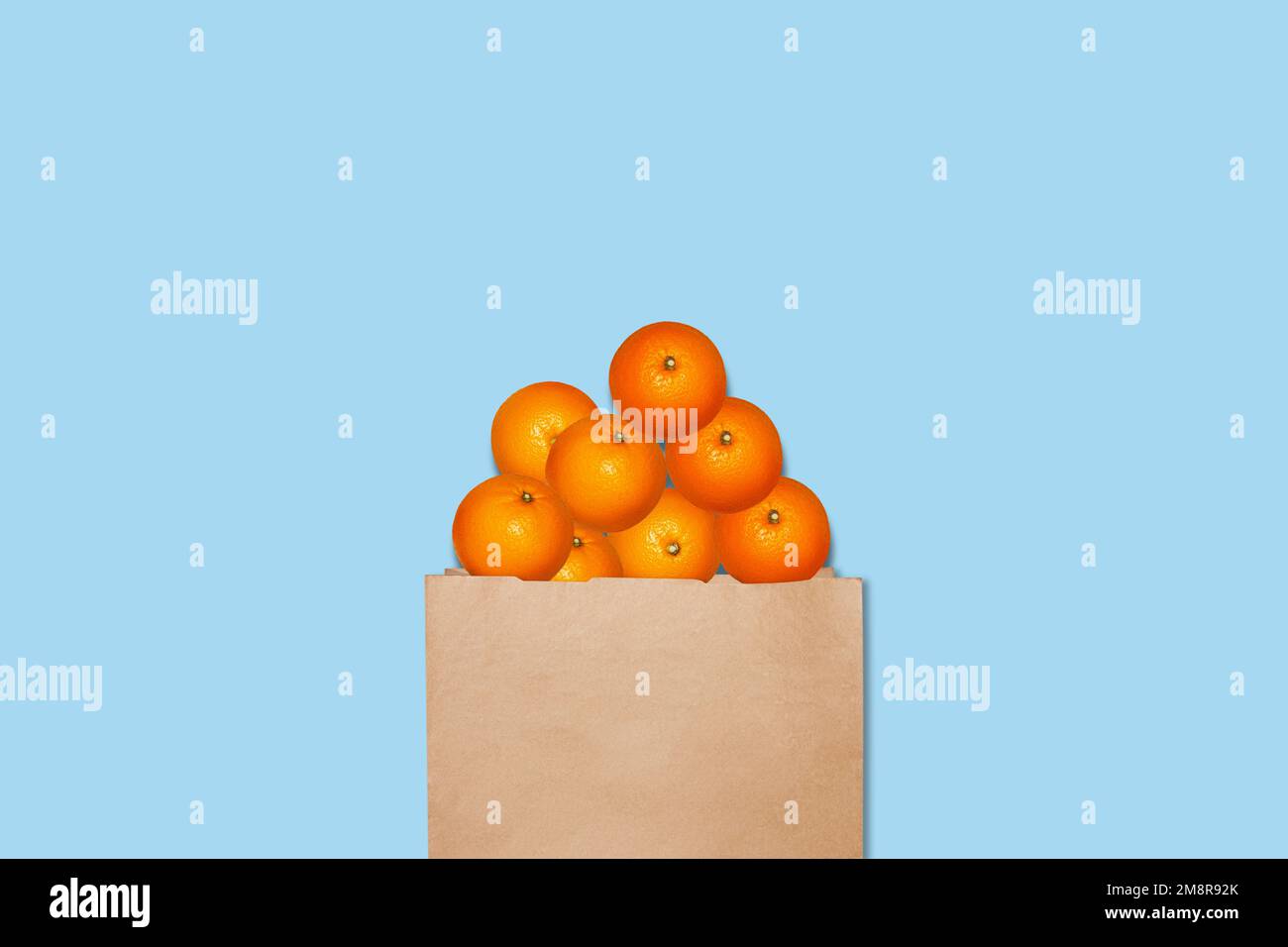 https://c8.alamy.com/comp/2M8R92K/oranges-in-a-paper-bag-on-a-blue-background-2M8R92K.jpg
