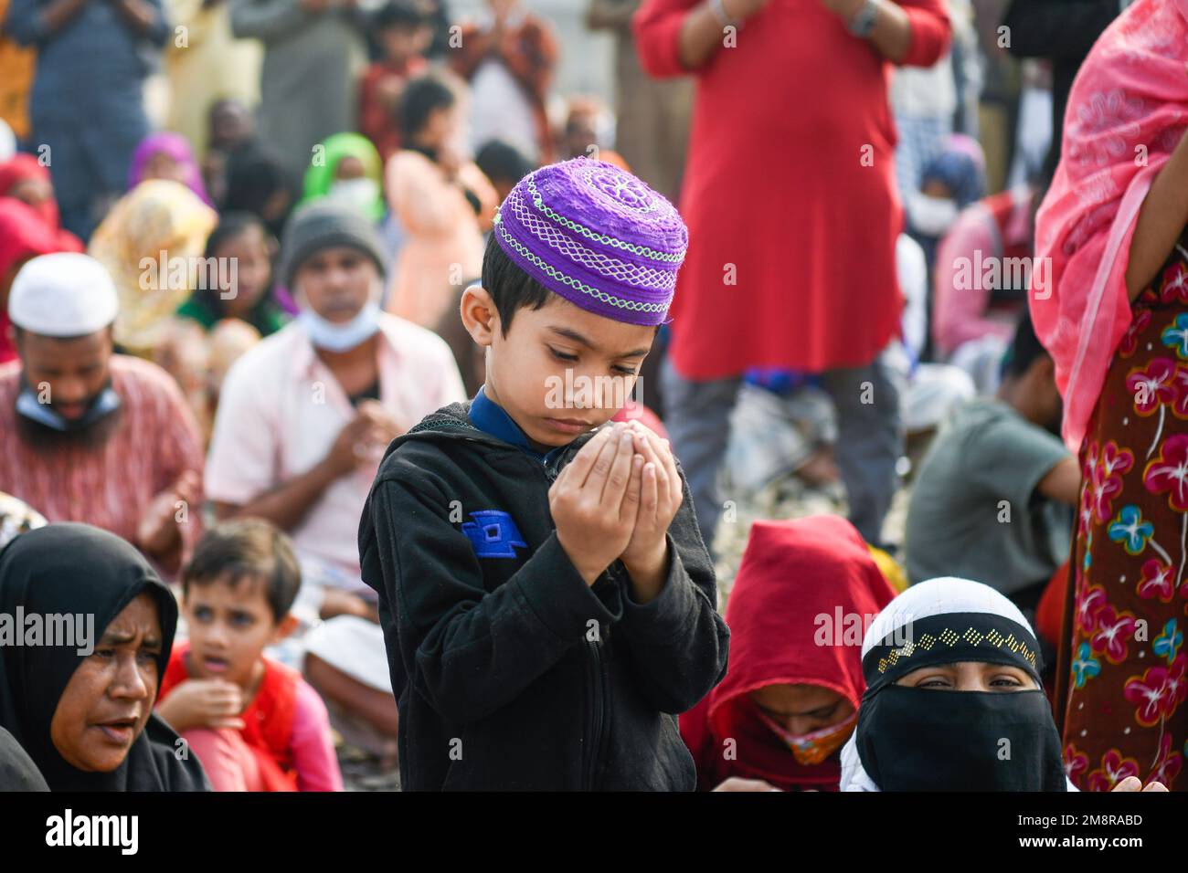 A Muslim kid takes part in the Akheri Munajat or final prayers during Biswa Ijtema, an annual congregation of Muslims in Tongi, some 20 kms north of Dhaka
