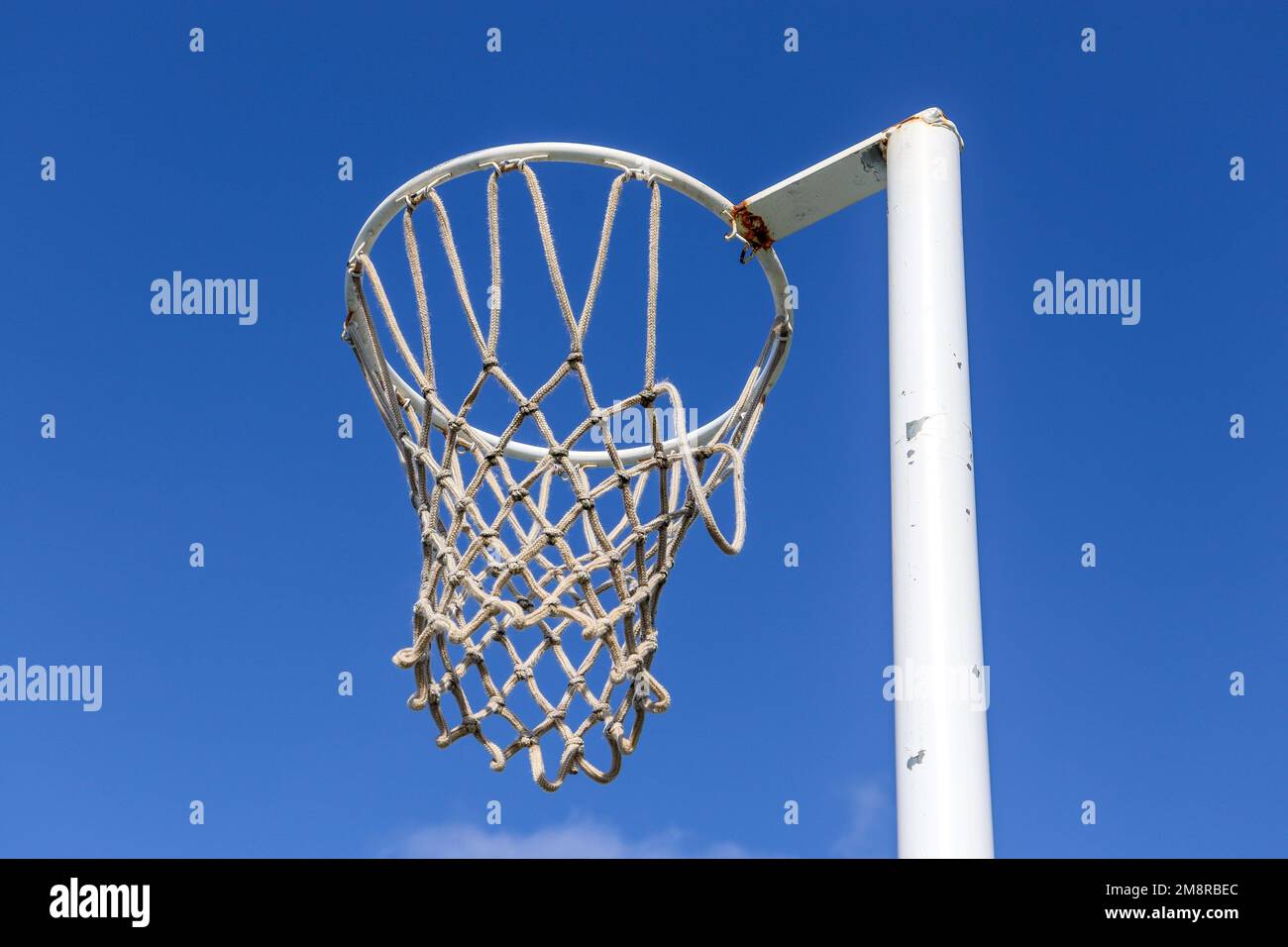 A netball hoop against a blue sky Stock Photo