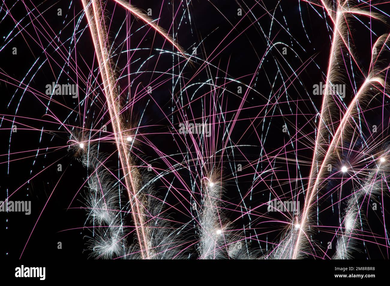 A fireworks display against the night sky Stock Photo