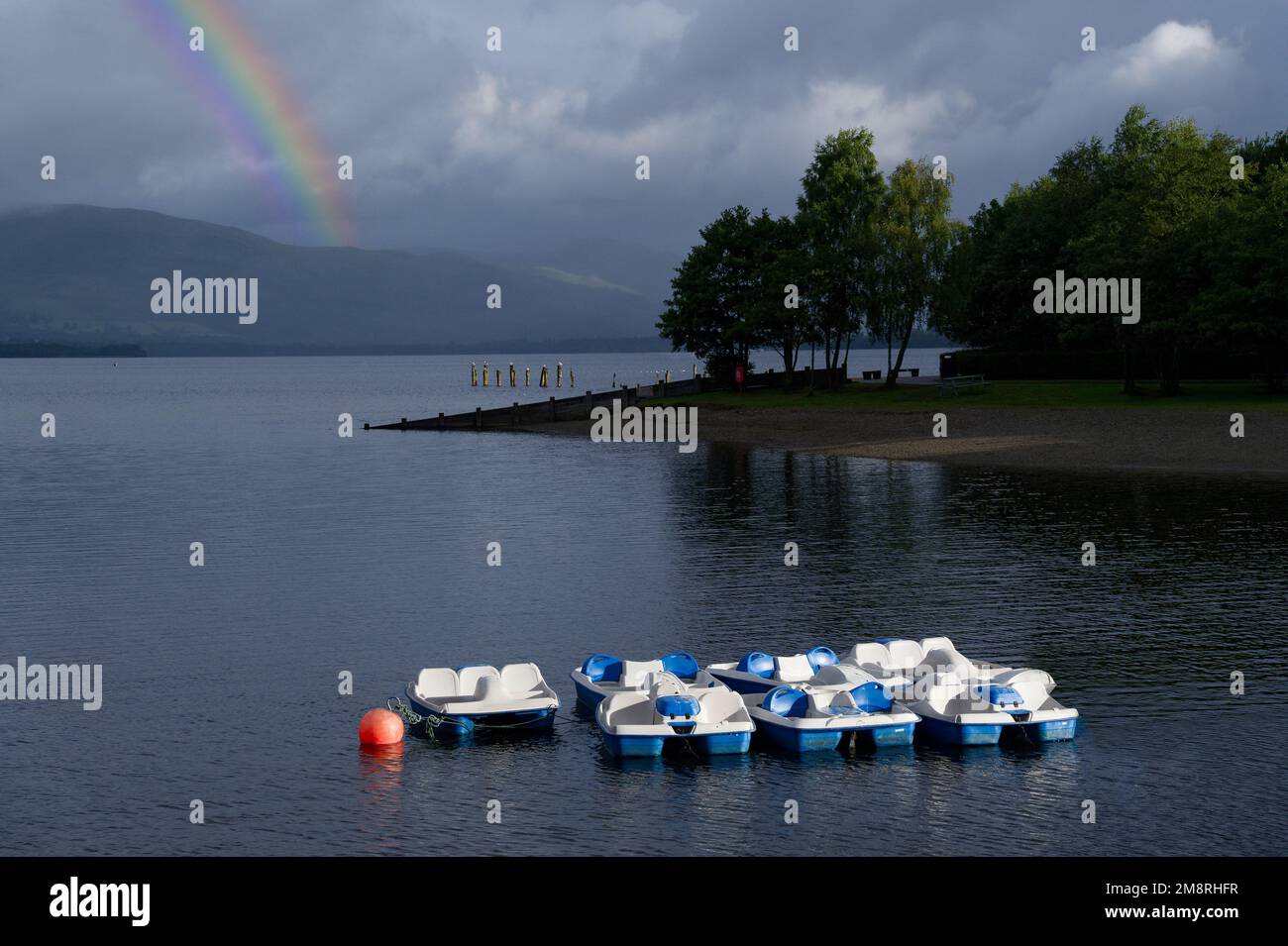 Pedal boats moored on Loch Lomond during storm Stock Photo Alamy