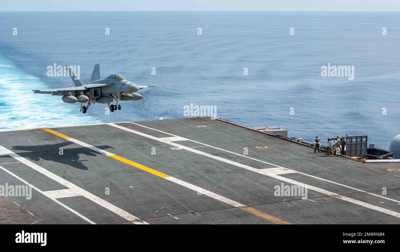 South China Sea, International Waters. 14th Jan, 2023. South China Sea, International Waters. 14 January, 2023. A U.S. Navy F/A-18F Super Hornet fighter aircraft, with the Fighting Redcocks of Strike Fighter Squadron 22 lands on the flight deck of the Nimitz-class aircraft carrier USS Nimitz, January 14, 2023 operating in the South China Sea. Credit: MC3 Caylen McCutcheon/U.S. Navy/Alamy Live News Stock Photo