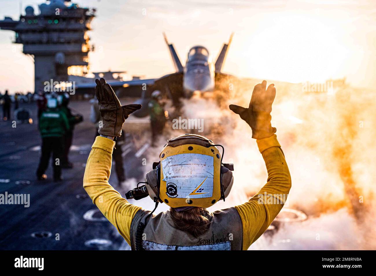 USS Nimitz, United States. 13th Jan, 2023. A U.S. Navy F/A-18E Super Hornet fighter aircraft from the Mighty Shrikes of Strike Fighter Squadron 94, is positioned for launch on the flight deck of the Nimitz-class aircraft carrier USS Nimitz at sunset underway conducting routine operations, January 13, 2023 in the South China Sea. Credit: MC2 David Rowe/U.S Navy Photo/Alamy Live News Stock Photo