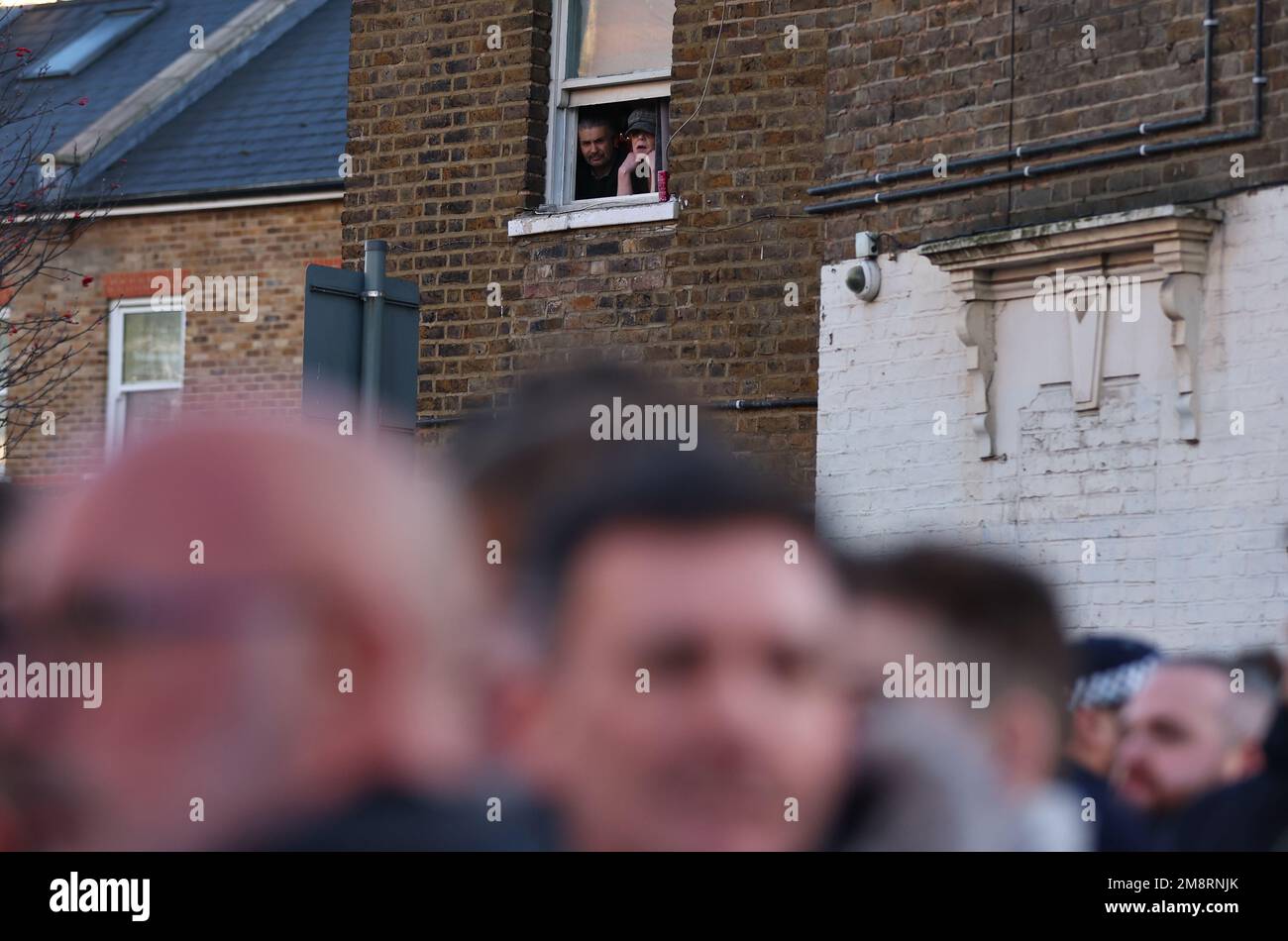 London, UK. 15th Jan, 2023. Local residents watch as fans gather before the match during the Premier League match at the Tottenham Hotspur Stadium, London. Picture credit should read: David Klein/Sportimage Credit: Sportimage/Alamy Live News Stock Photo