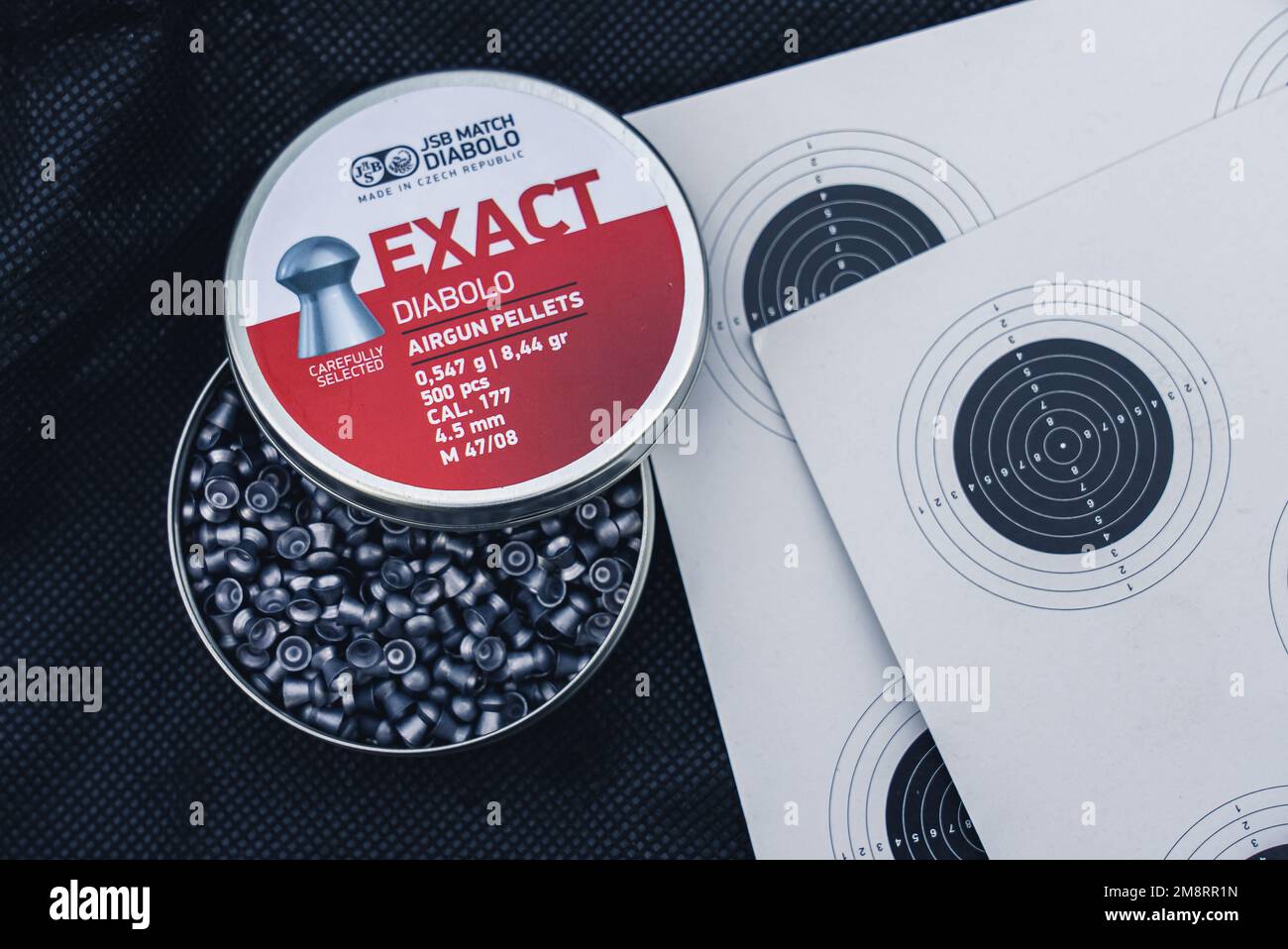 Airgun pellets and a paper shooting target. High quality photo Stock