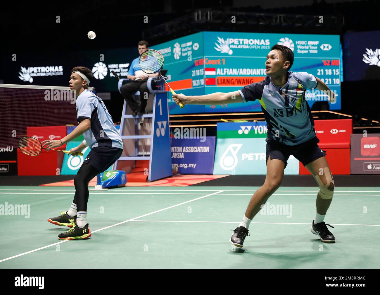 Fajar Alfian (R) and Muhammad Rian Ardianto of Indonesia play against Liang Wei Keng and Wang Chang of China during the Men Doubles Finals match of the Petronas Malaysia Open 2023 at