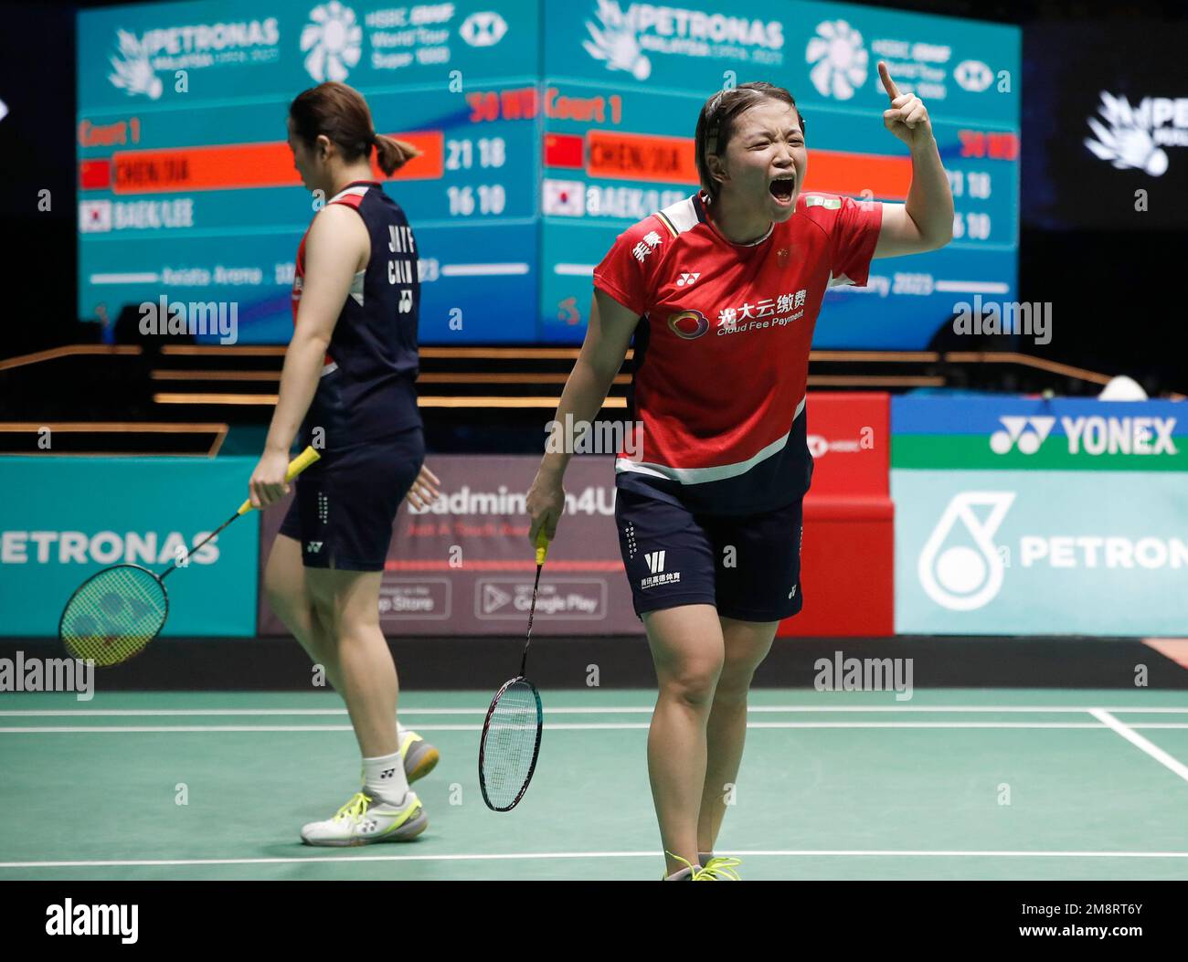 Kuala Lumpur, Malaysia. 15th Jan, 2023. Chen Qing Chen (L) and Jia Yi Fan of China react as they play against Baek Ha Na and Lee Yu Lim of Korea during the Women Doubles Finals match of the Petronas Malaysia Open 2023 at Axiata Arena.Chen Qing Chen and Jia Yi Fan of China won with scores; 21/21 : 16/10 Credit: SOPA Images Limited/Alamy Live News Stock Photo