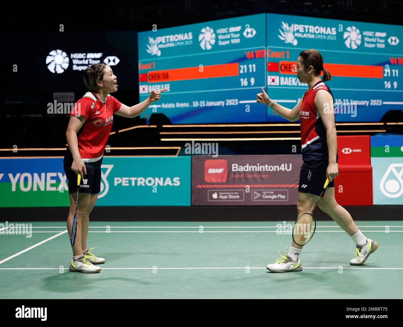 Kuala Lumpur, Malaysia. 15th Jan, 2023. Chen Qing Chen (L) and Jia Yi Fan of China react as they play against Baek Ha Na and Lee Yu Lim of Korea during the Women Doubles Finals match of the Petronas Malaysia Open 2023 at Axiata Arena.Chen Qing Chen and Jia Yi Fan of China won with scores; 21/21 : 16/10 Credit: SOPA Images Limited/Alamy Live News Stock Photo