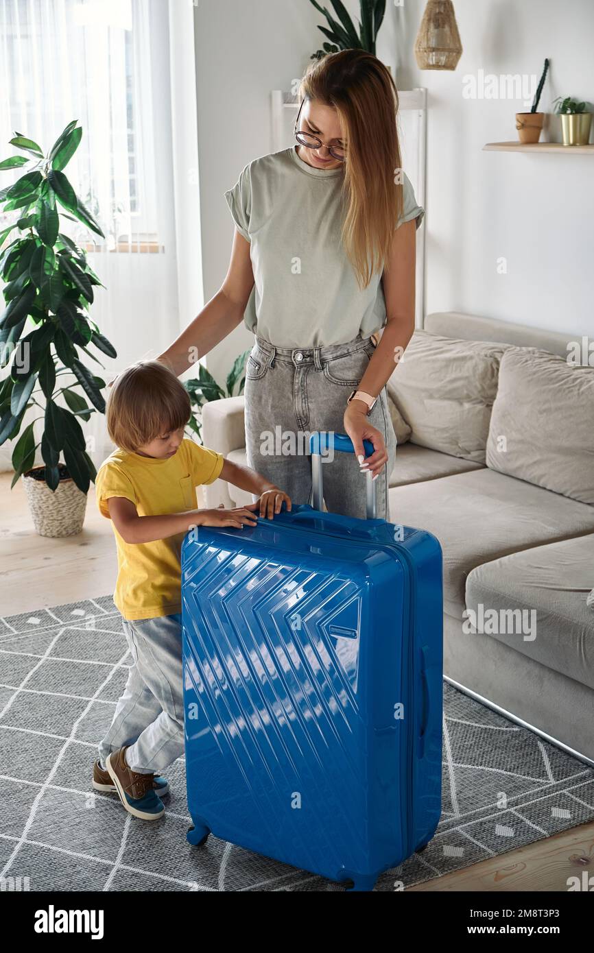 Happy family vacation suitcase hi-res stock photography and images - Alamy