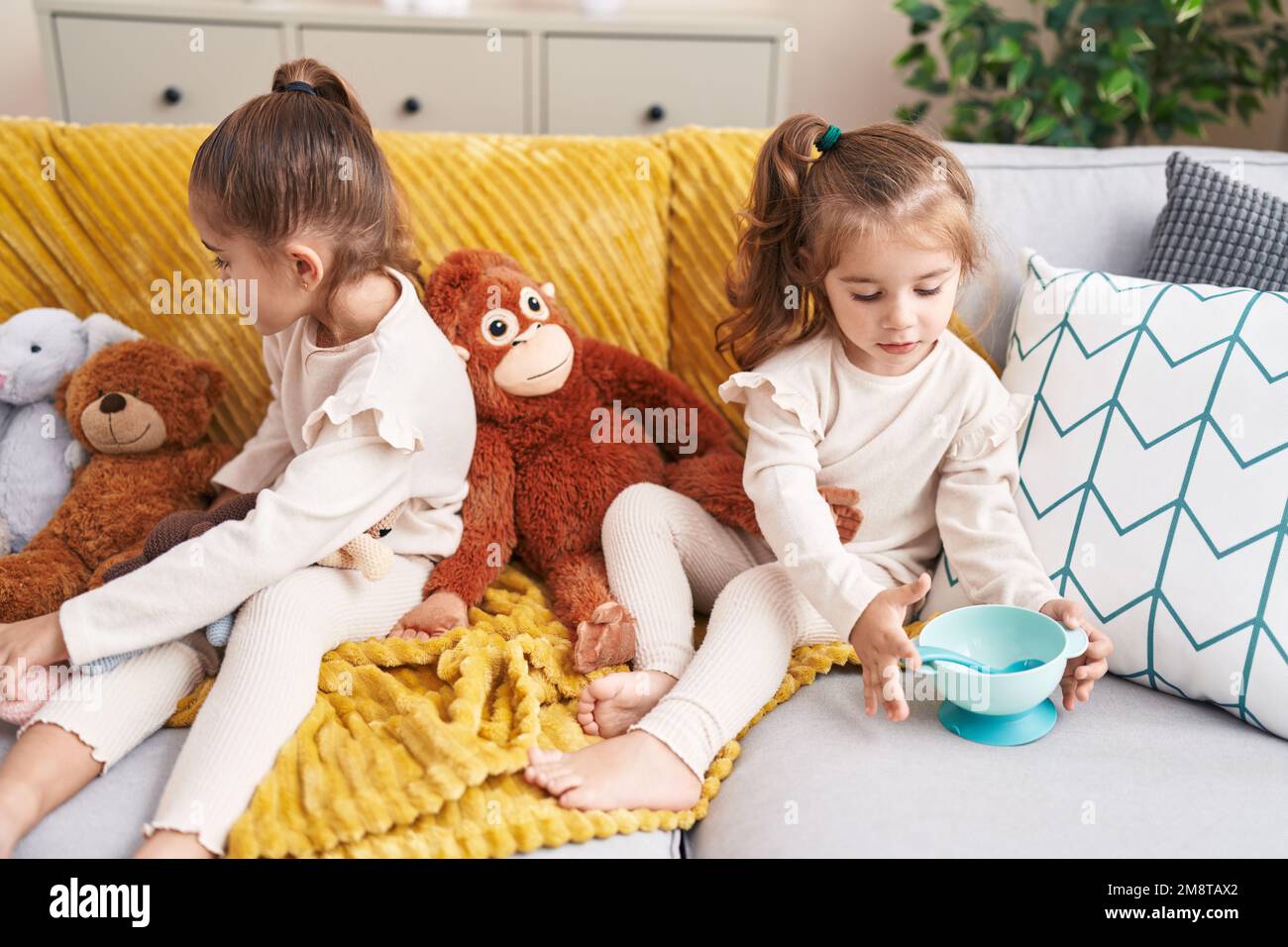 Two girls playing with dolls hi-res stock photography and images - Alamy