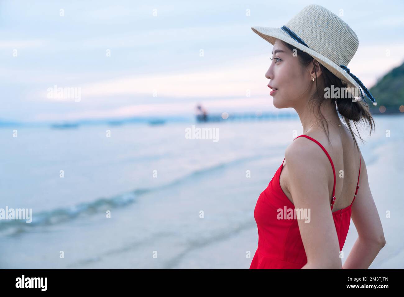 Happy young woman on the beach Stock Photo - Alamy