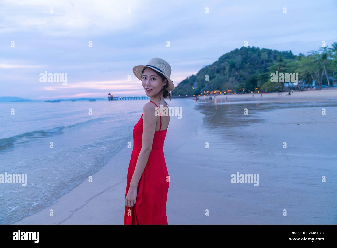 Happy young woman on the beach Stock Photo - Alamy