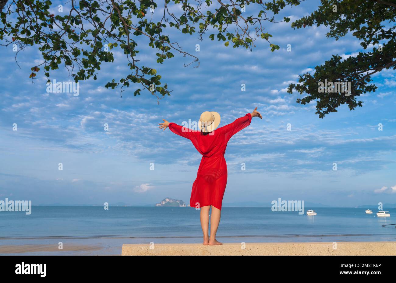 Happy young woman on the beach Stock Photo - Alamy