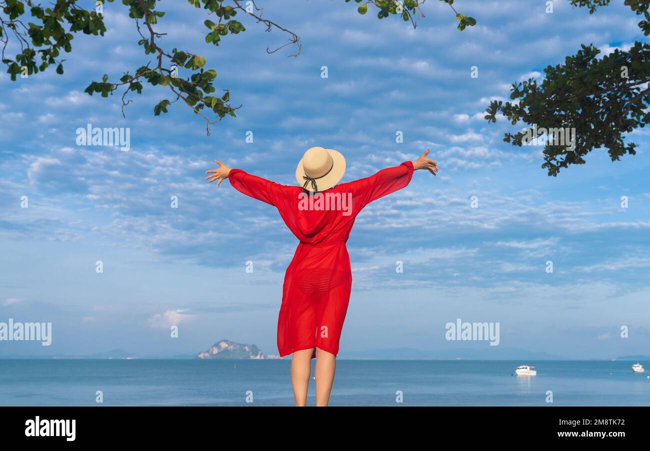 Happy young woman on the beach Stock Photo - Alamy