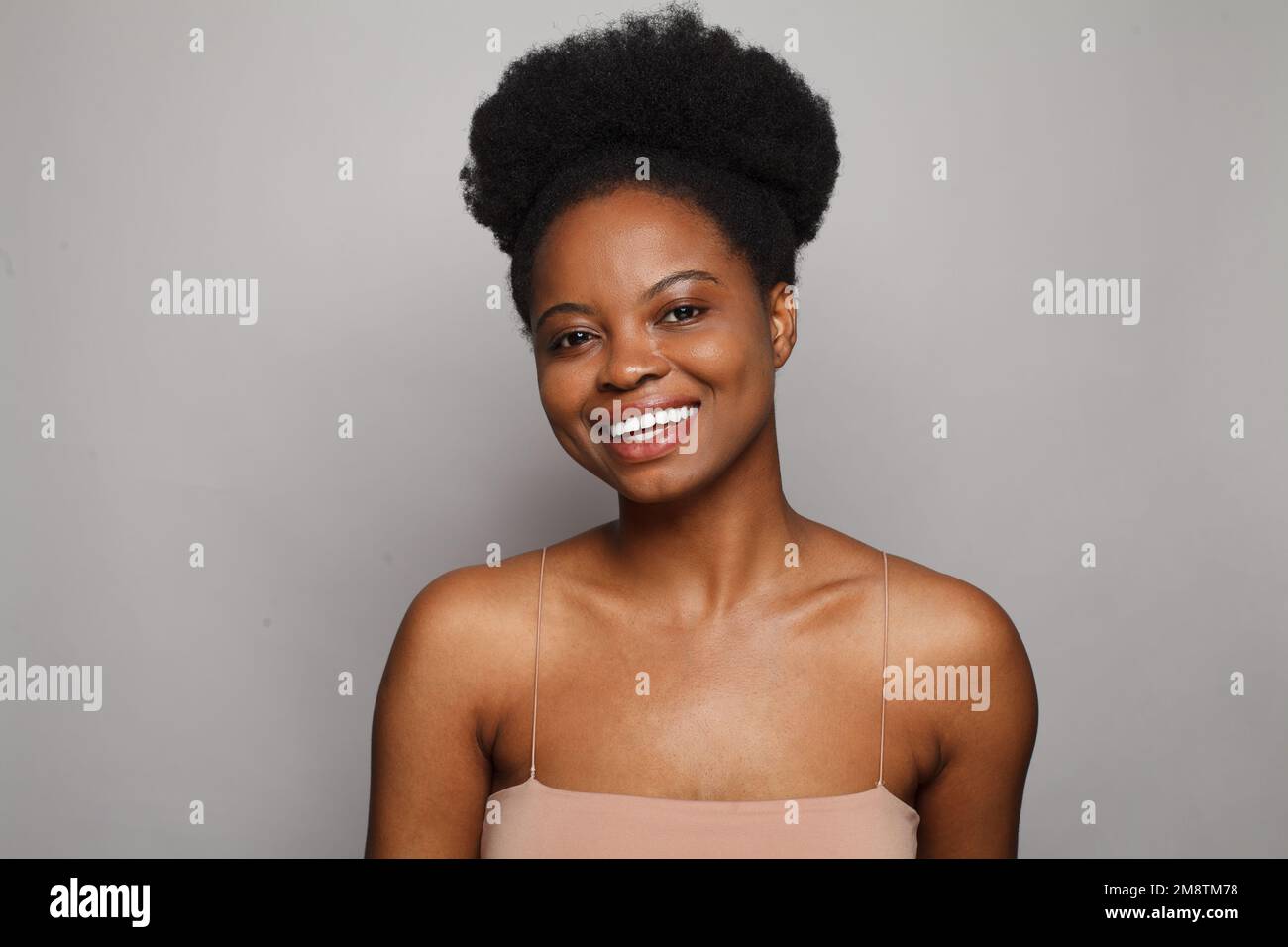 Beautiful friendly woman with fresh clean skin and positive smile on