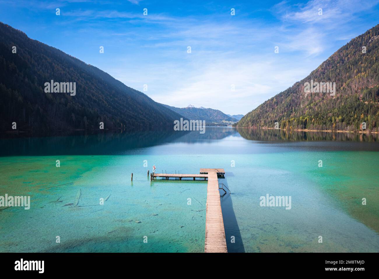 Lake Weissensee in Carinthia. Jetty at the east riverbank close to Stockenboi during autumn. Stock Photo