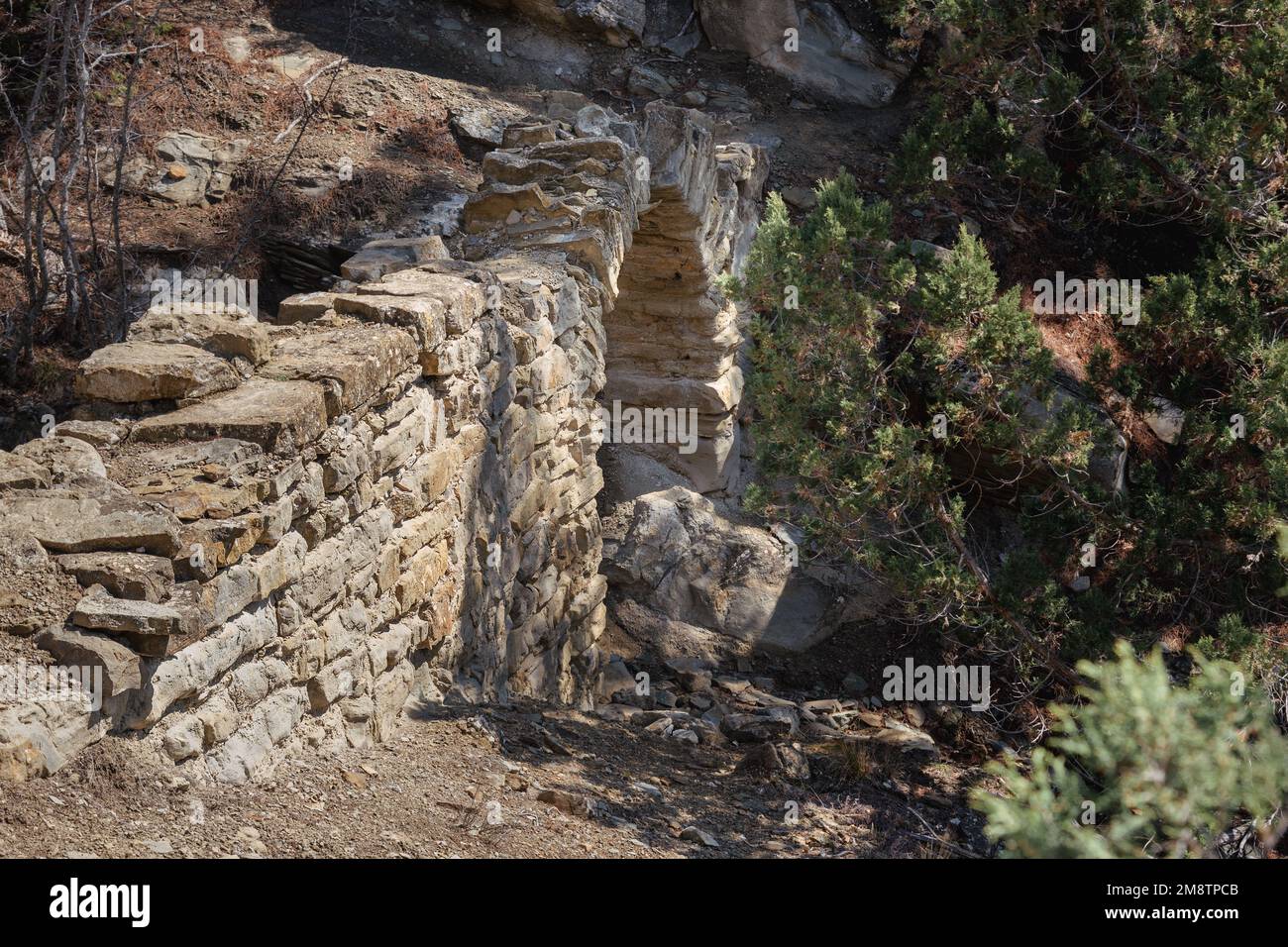 Old Small bridge aqueduct in mountain in spring. More than hundred years ago it was held Golitsyn plumbing. Crimea Stock Photo