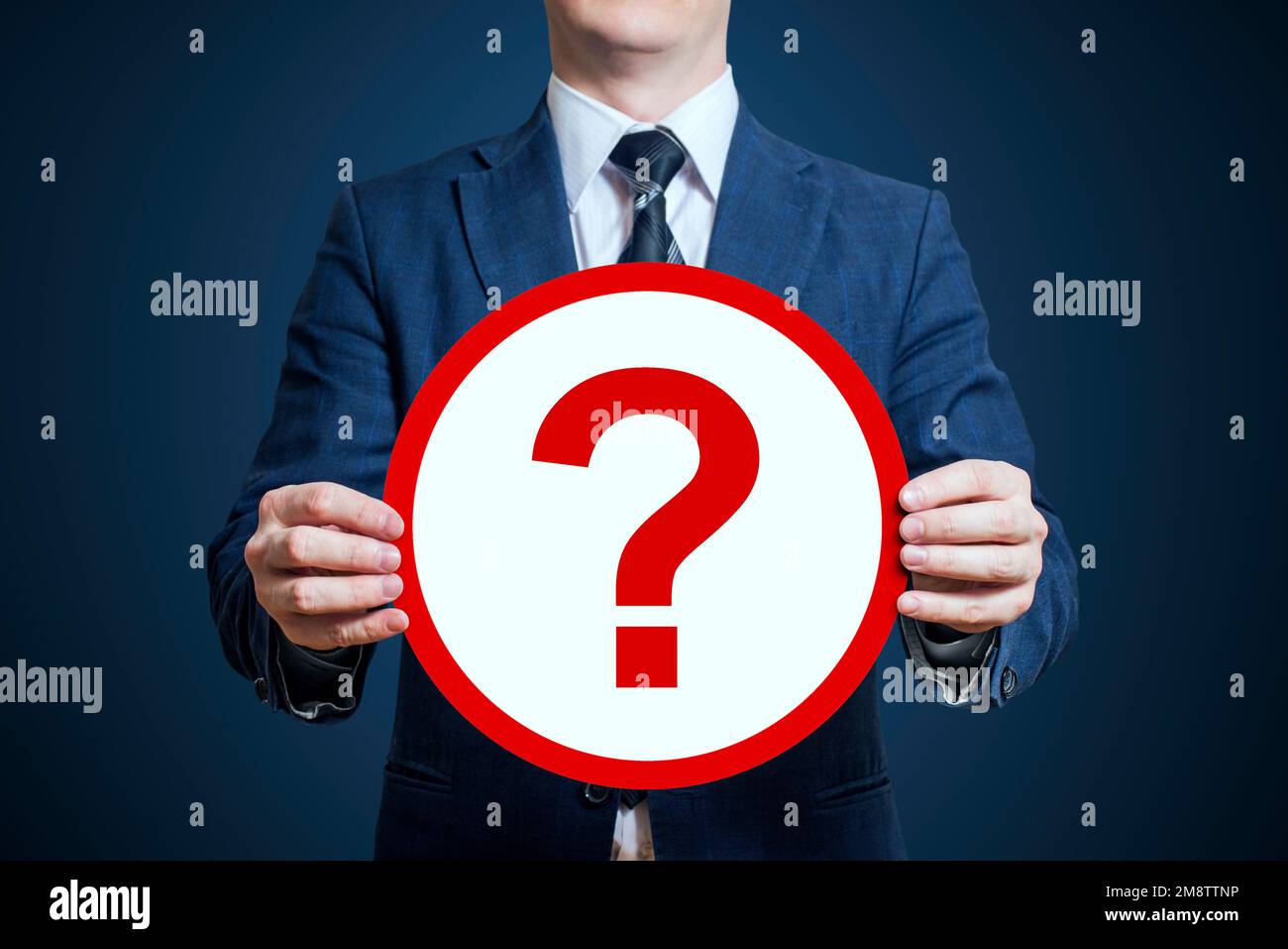 Businessman holding a poster 'question mark' Stock Photo