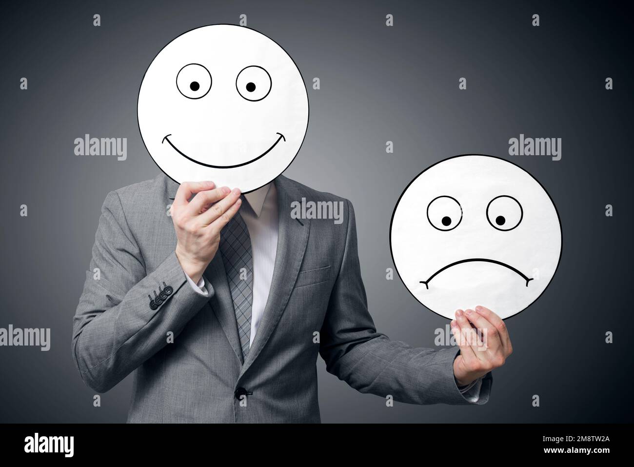 Conceptual image of a man changing his mood from bad to good Stock Photo