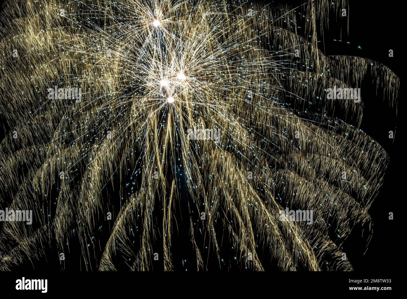 Fireworks exploding in the night sky Stock Photo