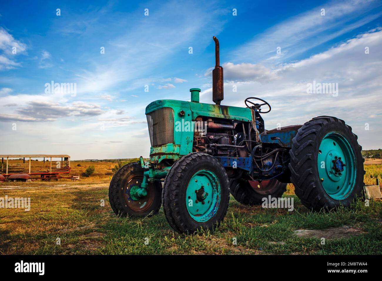 old tractor in field Stock Photo - Alamy