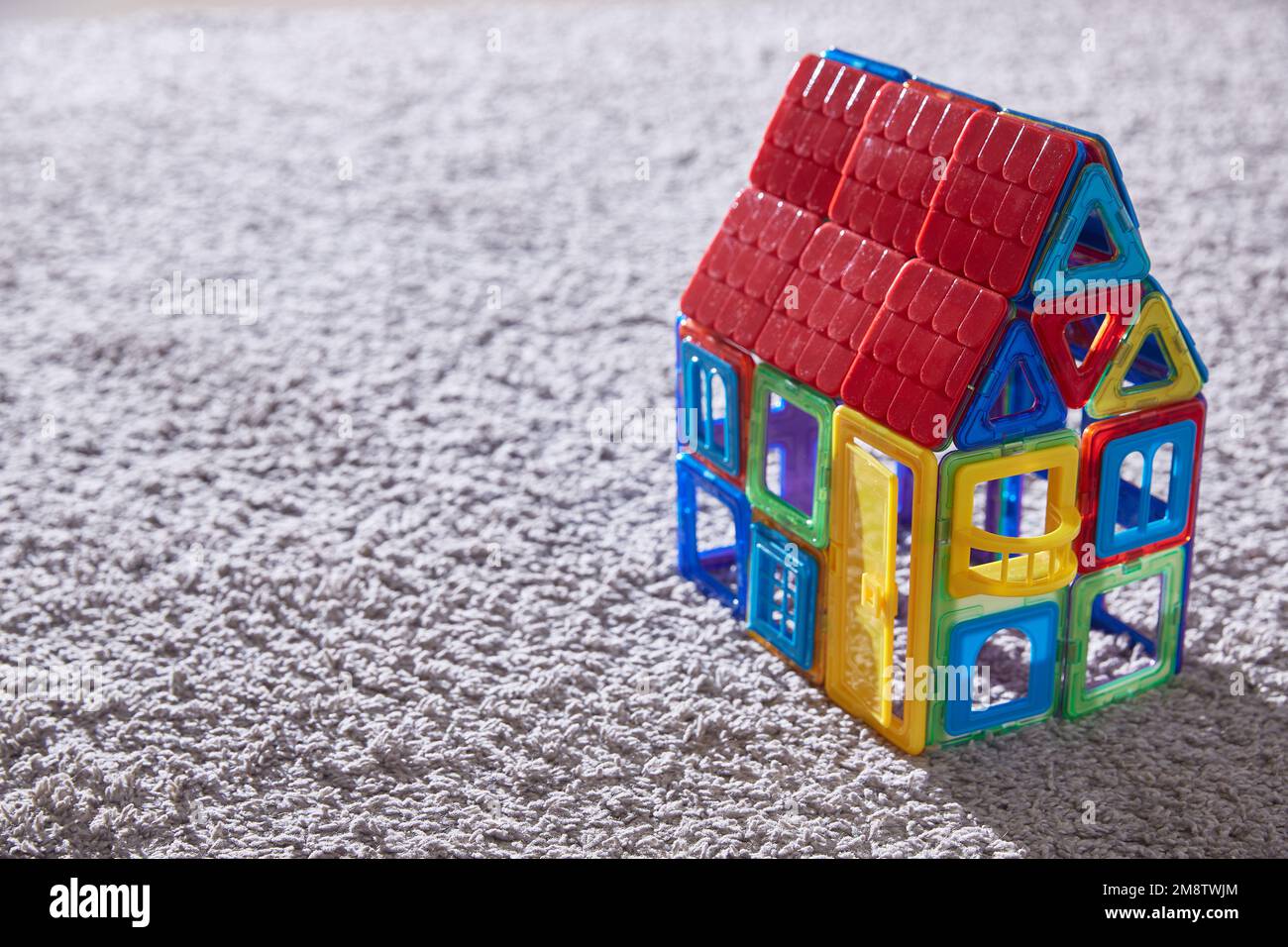 House toy constructor on the carpet. Copy space Stock Photo