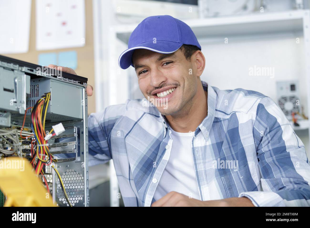 Smiling pc engineer repairing hi-res stock photography and images - Alamy