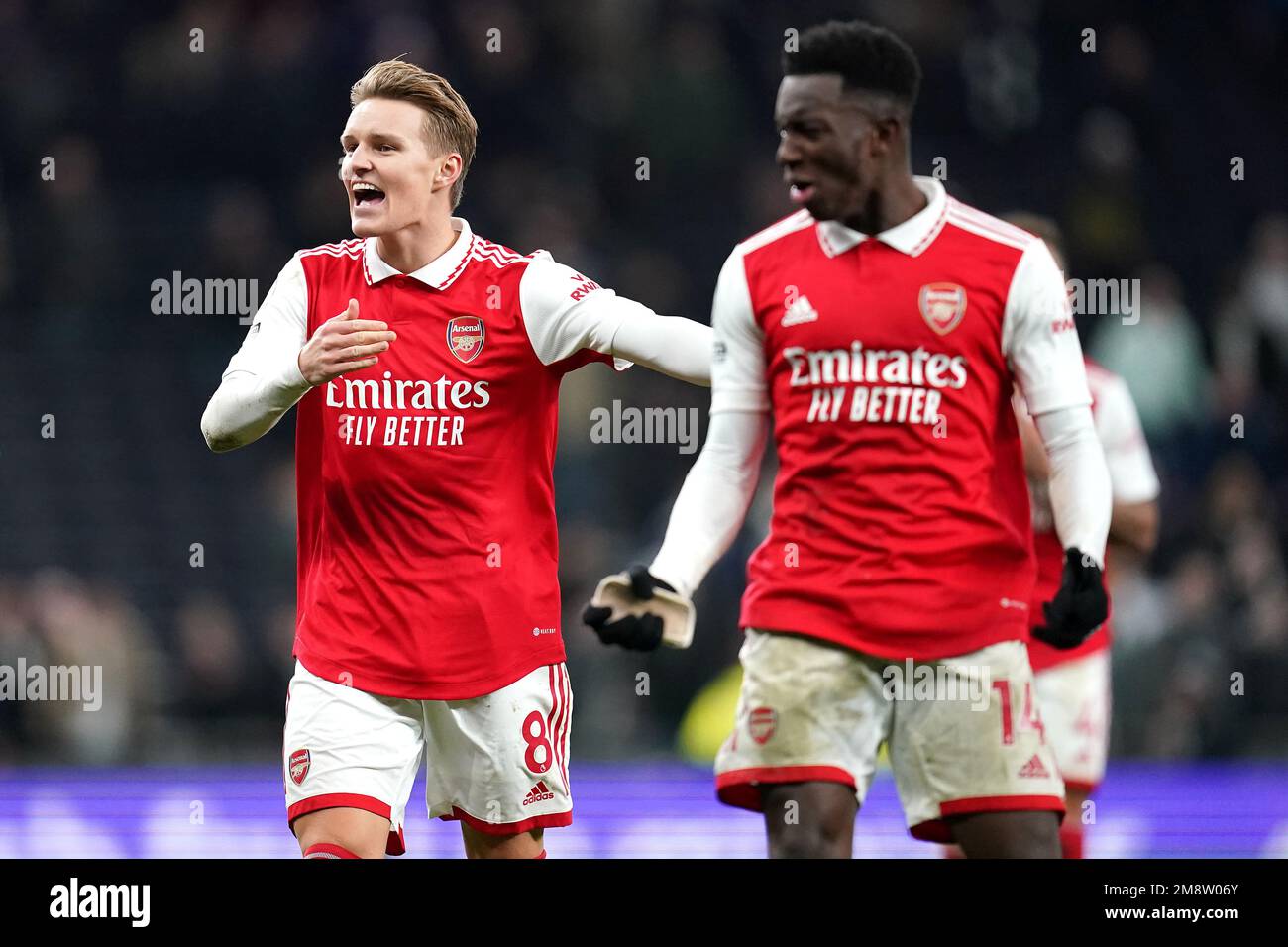 Arsenal's Martin Odegaard (left) and Eddie Nketiah celebrate in front