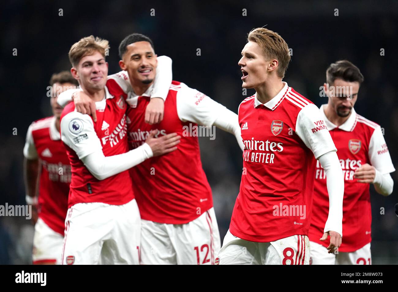 Arsenal's Martin Odegaard (second right) and teammates celebrate in