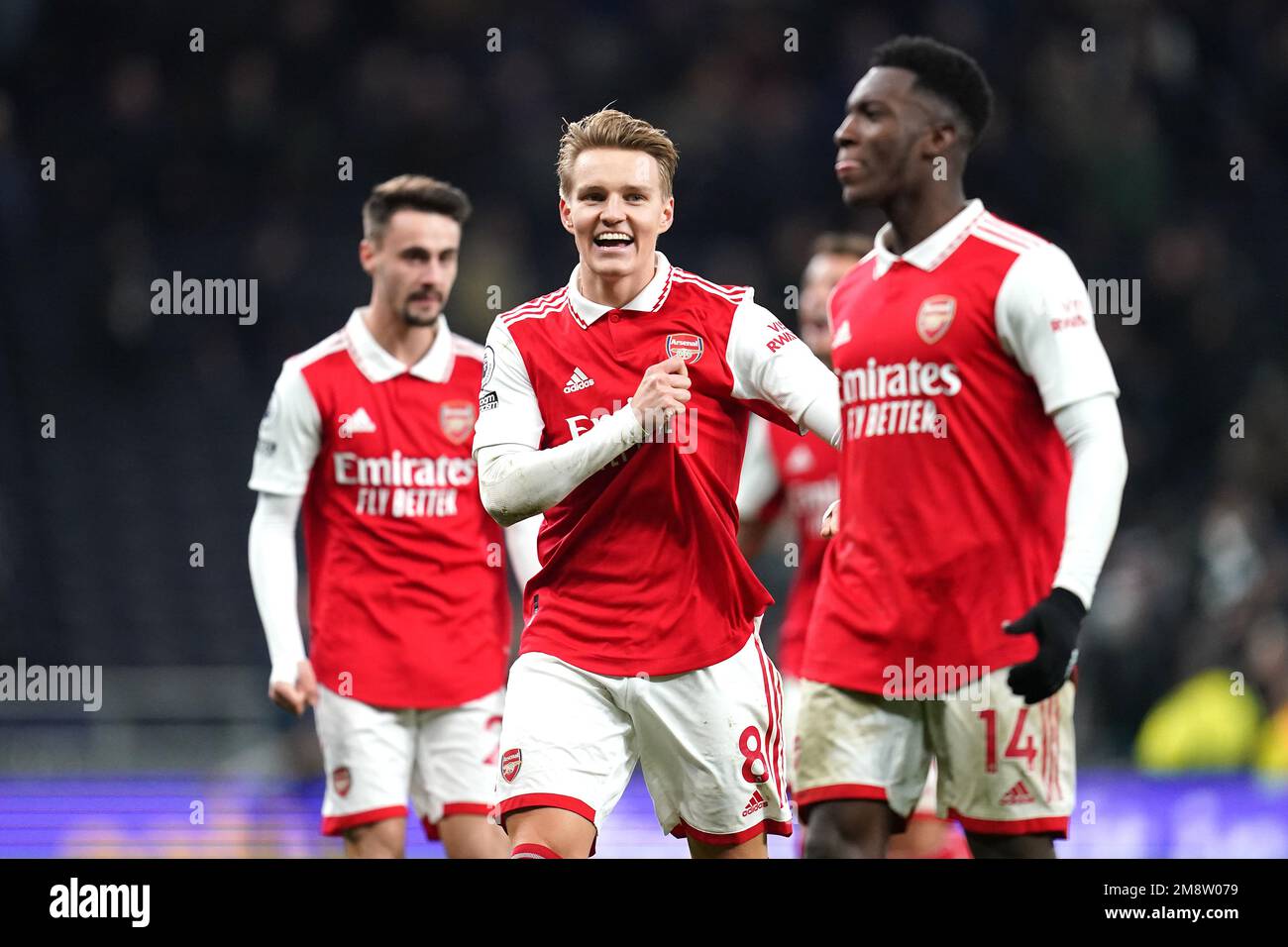Arsenal's Martin Odegaard (centre) and Eddie Nketiah (right) celebrate