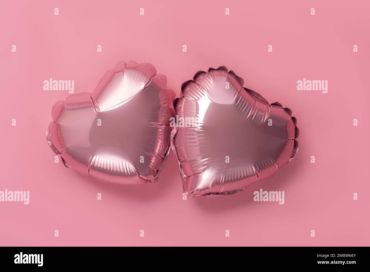 Pink background with red hearts balloons Stock Photo - Alamy