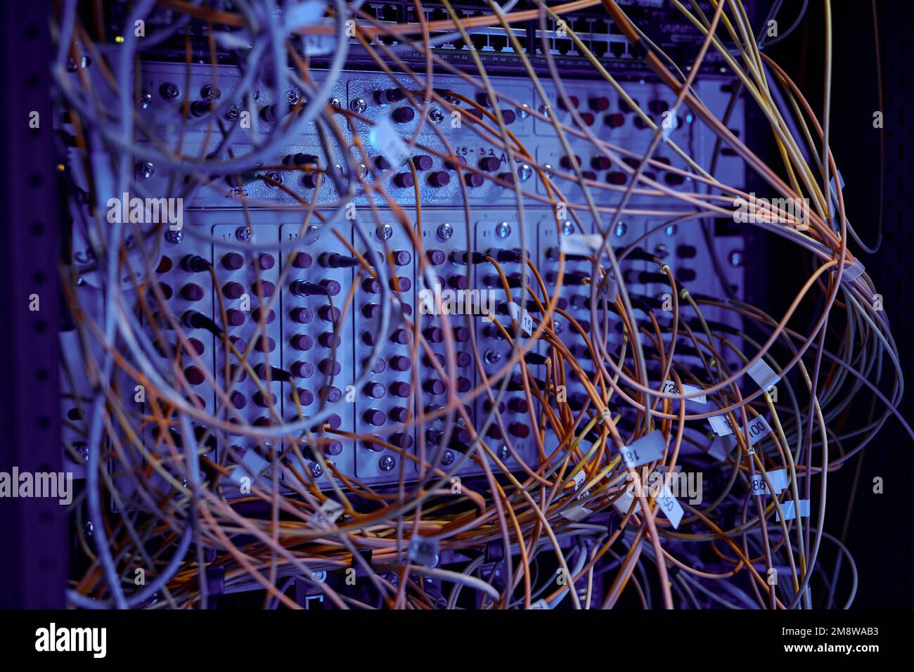 Close up background image of server cabinet with cables and wires in ...