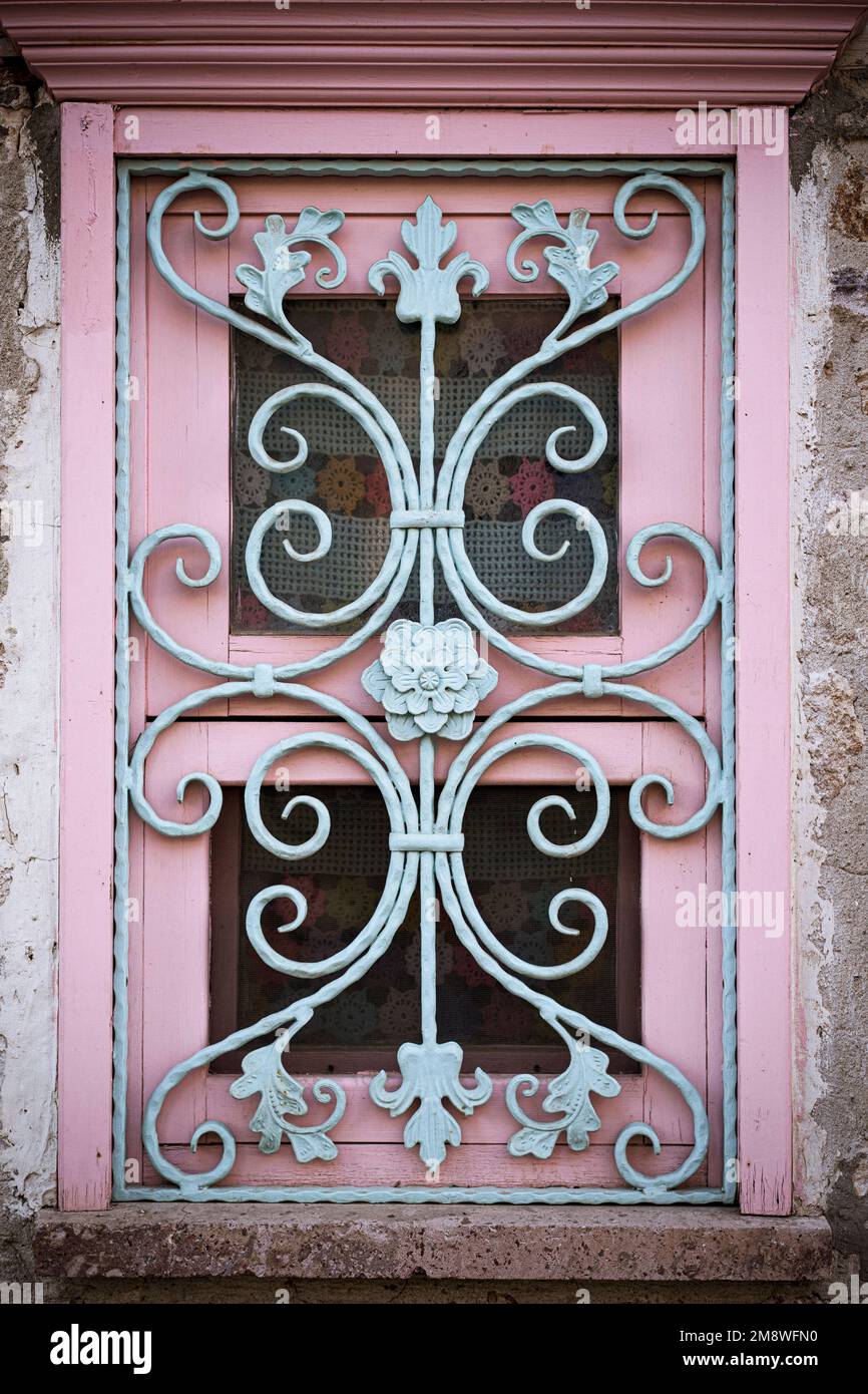 Window with decorated bars made of forged iron Stock Photo - Alamy