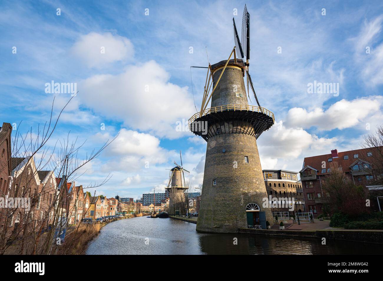 Classic view of traditional Dutch windmills in the historic city of Schiedam, Netherlands. Stock Photo