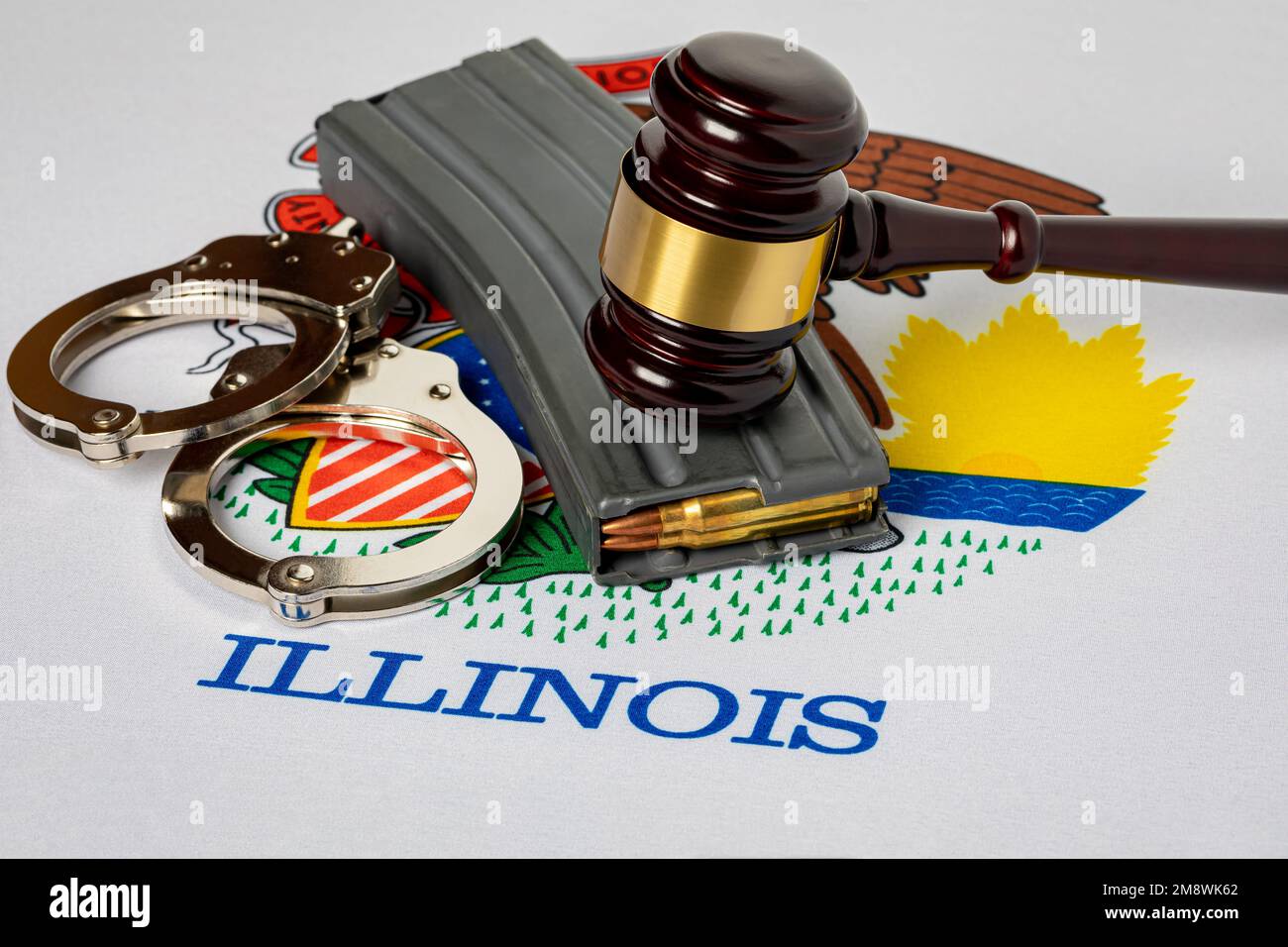 Assault weapon high-capacity magazine with gavel and Illinois state flag. Semi-automatic rifle ban, gun control law and crime concept. Stock Photo