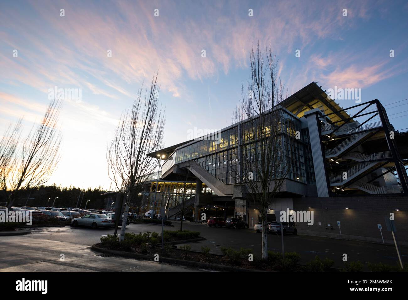 The sun rises over the Tukwila International Boulevard Link Light Rail Station in Tukwila, Washington. Stock Photo