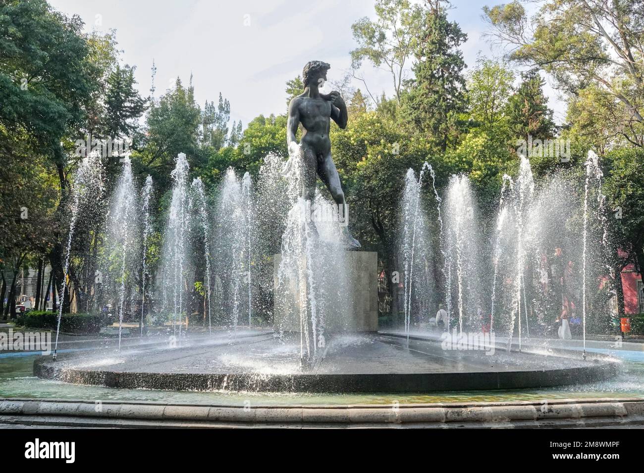 Replica statue of Michelangelo‘s David surrounded by a fountain in Rio de Janeiro Square in the hipster Colonia Roma Norte neighborhood of Mexico City, Mexico. Stock Photo