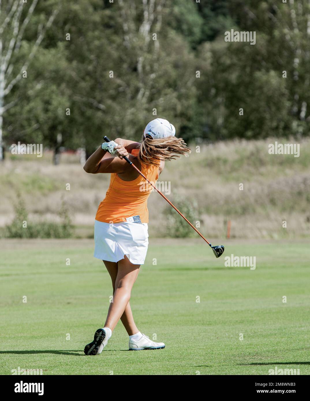 Professional Woman golfer  playing golf Stock Photo
