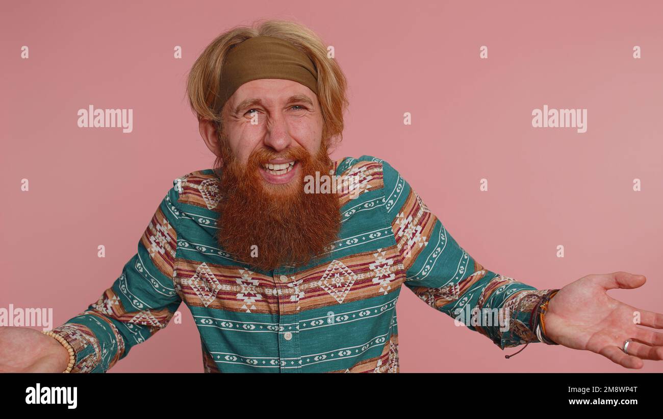 Indignant Slap What Why. Sincere irritated redhead hippie man raising hands in ...