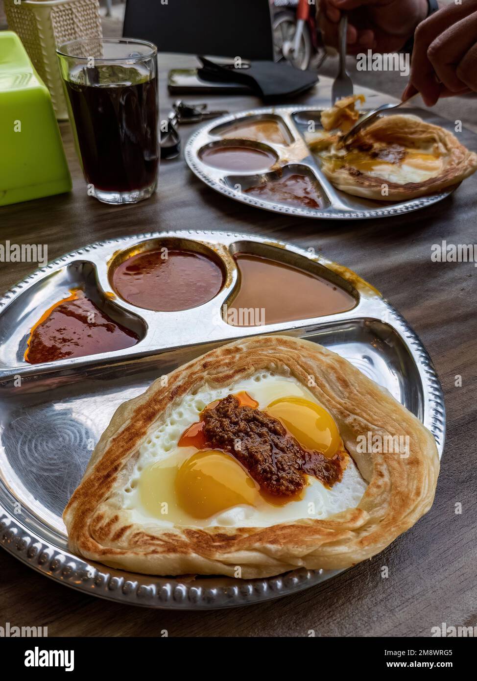a Roti sarang burung served with different gravies Stock Photo