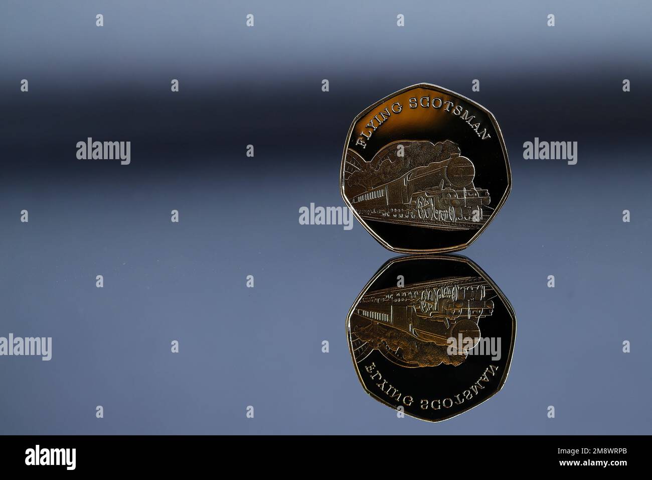 A Gold 50p coin featuring the Flying Scotsman which is not legal tender