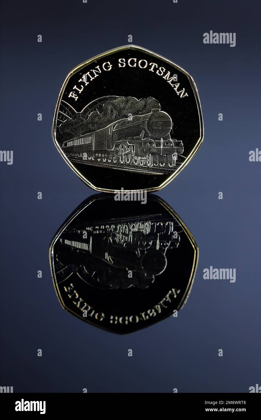 A Gold 50p coin featuring the Flying Scotsman which is not legal tender