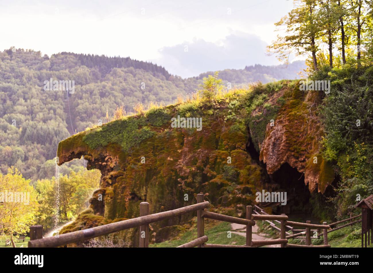 Waterfall in the mountains in italy. Autumn scenery in northern italy. High quality photo Stock Photo