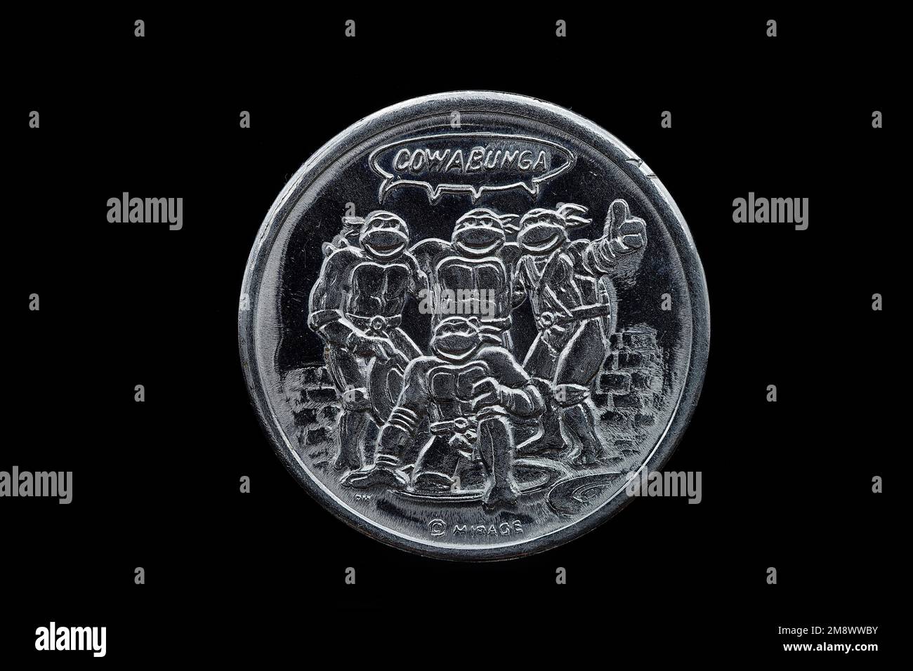 The reverse of a Teenage Mutant Hero Turtle medal issued in 1990 as part of a collection Stock Photo
